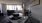 dining area open to living room with large windows